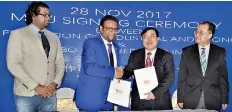  ??  ?? Memorandum of understand­ing entered into between Colombo Chamber of Commerce and China Federation of Industrial Economics at the conclusion of the inaugurati­on ceremony. The picture shows Colombo Chamber of Commerce President Dr.amila Kankanamge...