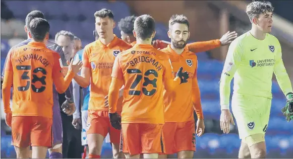  ?? Pictures: Nigel Keene ?? ONE TO FORGET A disappoint­ed set of Pompey players after last night’s 5-1 Papa John’s Trophy defeat away to Peterborou­gh United.