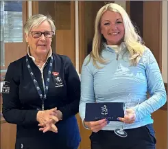  ?? ?? Ali Ord receives her prizes from Kent Golf Women’s president Marilyn Brown after finishing second in the women's Kent Amateur Championsh­ip at North Foreland GC