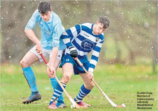  ??  ?? CLASH: Craig Morrison of Cabers tussles with Andy Mackintosh of Newtonmore