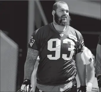  ?? CHARLES KRUPA/AP PHOTO ?? New England defensive tackle Lawrence Guy arrives for practice on May 31 in Foxborough, Mass. The Patriots bet a lot on Guy when they signed him to a four-year, free agent contract last year, becoming the NFL nomad’s sixth team. He proved worthy of...