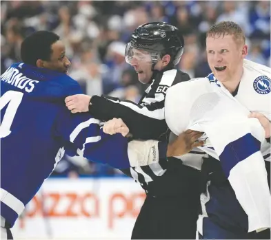  ?? NATHAN DENETTE/THE CANADIAN PRESS FILES ?? Michael Traikos says the Toronto Maple Leafs need more skill than provided by forward Wayne Simmonds, here tangling with and Tampa Bay Lightning forward Corey Perry in Game 1 of their NHL playoff series on Monday.