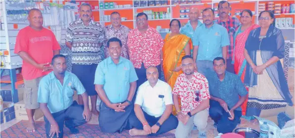  ?? Photo: Susana Hirst-Tuilau. ?? Rakiraki businessma­n George Shiu Raj (Back: standing third from left), Sigatoka Electric general manager Vijay Narayan, Rakiraki shop manager Shaneel Sharma (seventh from left), Sigatoka Electric Sales and Marketing manager Avin Nischal (third from left sitting) with close family at their new Rakiraki branch in Rakiraki Town.