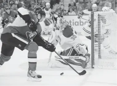  ?? SEAN KILPATRICK/ THE CANADIAN PRESS ?? Senators’ Milan Michalek attempts to get the puck past Canadiens goalie Peter Budaj during pre-season action Wednesday.