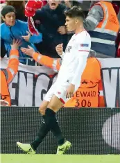  ??  ?? Sevilla’s Joaquin Correa celebrates scoring against Liverpool at Anfield on Wednesday.