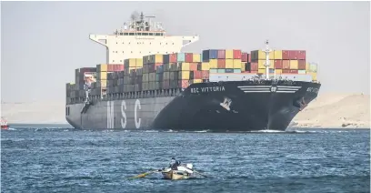  ?? Picture: EPA-EFE ?? SHORTCUT. A Mediterran­ean Shipping Company container ship crosses the Suez Canal towards the Red Sea in Ismailia, Egypt, on 22 December. Attacks by Houthi rebels have forced major shipping companies to reroute their operations.