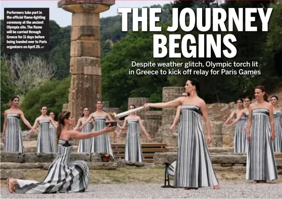  ?? AP ?? Performers take part in the official flame-lighting ceremony at the ancient Olympia site. The flame will be carried through Greece for 11 days before being handed over to Paris organizers on April 26.