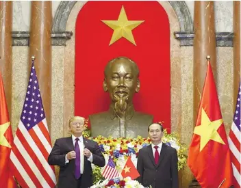  ?? AP FOTO ?? US President Donald Trump (left) and Vietnamese President Tran Dai Quang pose for photograph­ers at the Presidenti­al Palace in Hanoi.ASIAN VISIT.