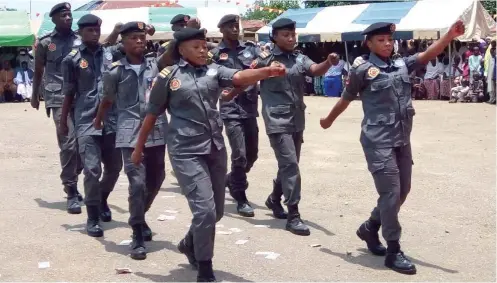  ??  ?? Newly recruited members of the vigilante group during a march past in Kotonkarfe recently.