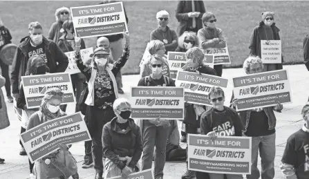  ?? ?? Supporters of Fair Districts in Ohio rally outside the Ohio Statehouse in Columbus after an Ohio Redistrict­ing Commission held a meeting on Oct. 28.
