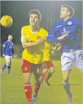  ??  ?? Battle Ross Gilmour fights for the ball