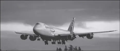  ?? ASSOCIATED PRESS ?? The final Boeing 747 lands at Paine Field following a test flight, Tuesday, in Everett, Wash. Boeing bid farewell to an icon on Tuesday, when it delivered the jumbo jet to cargo carrier Atlas Air.