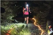  ?? COURTESY FAITH HALL ?? A female competitor begins the race in the nighttime hours during the 2021Easter­n States 100.