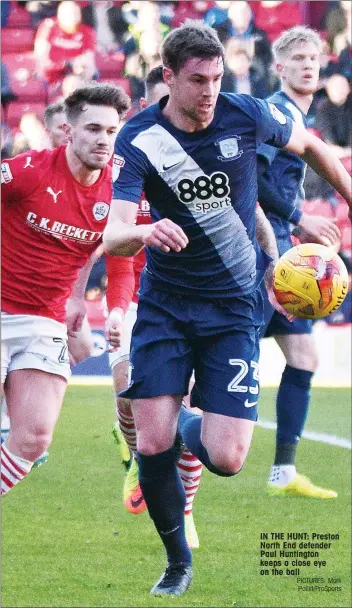  ?? PICTURES: Mark Pollitt/ProSports ?? IN THE HUNT: Preston North End defender Paul Huntington keeps a close eye on the ball