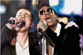  ??  ?? Chart toppers: Wiz (right) and Puth performing during an event inTimes Square in New York. — AFP