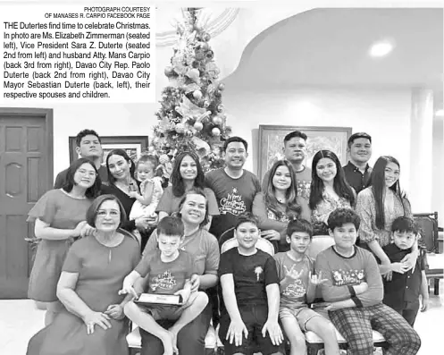  ?? PHOTOGRAPH COURTESY OF MANASES R. CARPIO FACEBOOK PAGE ?? THE Dutertes find time to celebrate Christmas. In photo are Ms. Elizabeth Zimmerman (seated left), Vice President Sara Z. Duterte (seated 2nd from left) and husband Atty. Mans Carpio (back 3rd from right), Davao City Rep. Paolo Duterte (back 2nd from right), Davao City Mayor Sebastian Duterte (back, left), their respective spouses and children.
