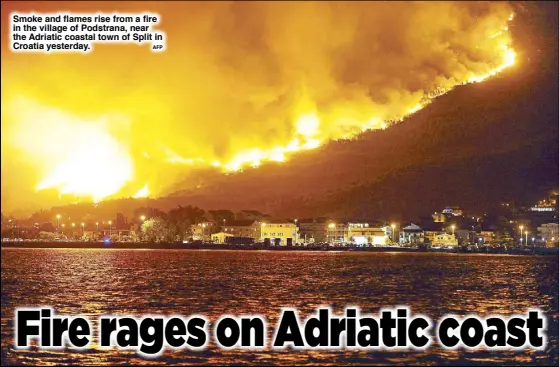  ?? AFP ?? Smoke and flames rise from a fire in the village of Podstrana, near the Adriatic coastal town of Split in Croatia yesterday.