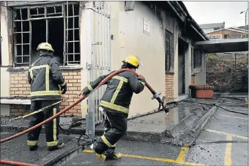  ?? Picture: EUGENE COETZEE ?? ON THE JOB: Firemen at the scene of an office fire at The House of Biscuits yesterday