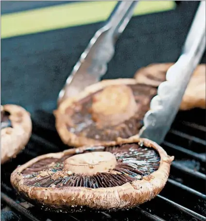  ?? DREAMSTIME ?? Grill the portobello mushroom “buns” until golden, turning only once.