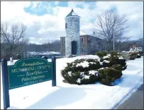  ?? Ernest A. Brown photo ?? The Longfellow Municipal Center, which includes the former town hall building, pictured behind the tower, is shown on a picturesqu­e late winter’s day Thursday.