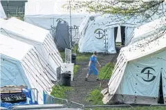  ?? REUTERS ?? A health worker walks in the Samaritan’s Purse Emergency Field Hospital in Central Park in New York on Sunday.