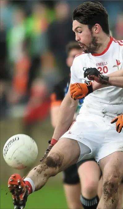  ?? Pictures: Eóin Noonan/Sportsfile ?? Eoin O’Connor tries to clear his lines as Ben Crealey closes in for Armagh.