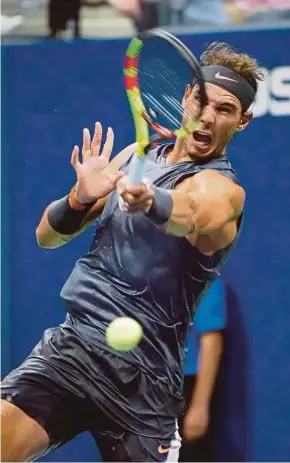  ?? AFP PIC ?? Rafael Nadal hits a return to David Ferrer during their US Open match on Monday.