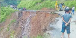  ?? HT PHOTO ?? Authoritie­s clear the ImphalJiri­bam National Highway 37, which sunk to a depth of 60 feet due to heavy rainfall, between Sinam and Laijang villages on Sunday. Manipur has been battered by floods, landslides and storms for the past two months....