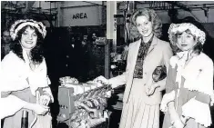  ??  ?? > 1981: Miss UK Michele Donnelly gives a helping hand to push the half-millionth engine off the production line at Bridgend