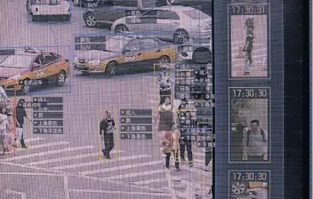  ?? Picture: GILLES SABRIE/BLOOMBERG VIA GETTY IMAGES ?? WATCHED: A screen shows a demonstrat­ion of SenseTime Group Ltd's SenseVideo pedestrian and vehicle recognitio­n system.