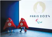  ?? AFP ?? Official Olympic Phryges mascots are displayed in the headquarte­rs of the Paris 2024 Organizing Committee for the Olympic and Paralympic Games, in SaintDenis, outside Paris.