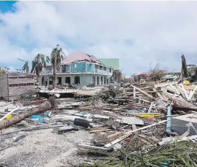  ?? PHOTOS: LIONEL CHAMOISEAU / AFP / GETTY IMAGES ?? The damage to Orient Bay is seen on the Caribbean island of St. Martin Thursday, after Hurricane Irma tore through it on Wednesday. The island, which is divided between the Netherland­s and France, saw the worst damage so far.