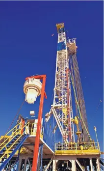  ?? COURTESY OF DEVON ?? A drilling rig works on Devon Energy well pads on New Mexico’s side of the Permian Basin. The oil industry is grappling with who owns vast amounts of data that outline undergroun­d resources.