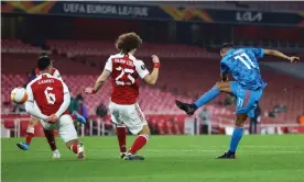  ??  ?? Youssef El-Arabi wins the second leg for Olympiakos with his second-half strike, but Arsenal’s first-leg advantage proved too steep to overcome. Photograph: Julian Finney/Getty