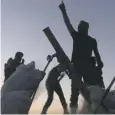  ??  ?? 0 Syrian fighters cheer as they prevail over IS forces