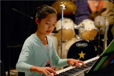  ??  ?? Min Smith showed great poise and confidence during her piano solo.