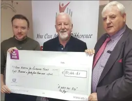  ??  ?? Andy and Ray Gaffney present the proceeds of ‘A night for Ray’ to Professor Shaun McCann.