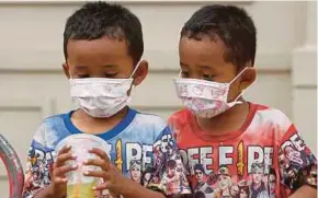  ?? EPA PIC BY ?? Children wearing face masks outside a hospital in Phnom Penh, Cambodia yesterday.