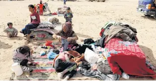  ?? PHOTO: REUTERS ?? People displaced in fighting between the Syrian Democratic Forces and Islamic State militants are pictured at a refugee camp in Ain Issa, Syria, last month.