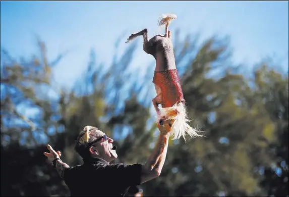  ?? Andrea Cornejo Las Vegas Review-Journal @dreacornej­o ?? Lou “Mack” McCammon, founder of CoolDog Production­s, performs with his dog during Jump! The Ultimate Dog Show on Saturday at the Springs Preserve. The Las Vegas-based company produces action-packed performanc­es and features a variety of dogs performing...