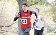  ?? JASON BAIN EXAMINER ?? Jack Workman of Crestwood Secondary School (125) nears the finish line before finishing first, edging second-place Alex Jackett of Lindsay’ St. Thomas Aquinas (151) in the midget boys category of the Kawartha High School Cross Country Running Meet at Jackson Park Wednesday.