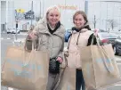  ??  ?? Primark fans Danielle Sartrain and Sarah Douglas with their haul of shopping bags