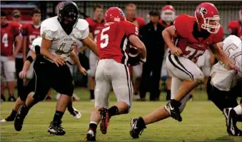  ?? ENTERPRISE-LEADER ?? Farmington runningbac­k Spencer Boudrey cuts inside of a West Fork defender as tackle Zach Nickell blocks. Boudrey rushed 11 times for 61 yards and a touchdown with no fumbles in bad weather.