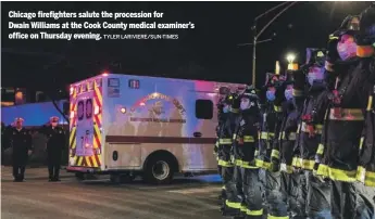  ?? TYLER LARIVIERE/ SUN- TIMES ?? Chicago firefighte­rs salute the procession for Dwain Williams at the Cook County medical examiner’s office on Thursday evening.