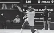  ?? [AP PHOTO] ?? Serena Williams of the United States returns the ball to France’s Kristina Mladenovic Friday during their women’s singles match on the fifth day of the Wimbledon Tennis Championsh­ips in London.