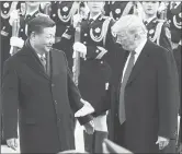  ?? Abaca Press/tns ?? From left, China’s President Xi Jinping and U.S. President Donald Trump shake hands on Nov. 9, 2017, during a meeting outside the Great Hall of the People in Beijing.