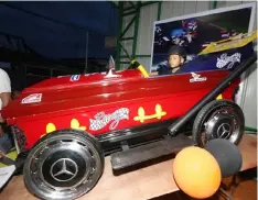  ?? Chris Navarro ?? TO THE FINAL DESTINATIO­N? A kid tries a casket dressed up as a race car during the ‘OkAtaol’Festival held Wednesday in Sto. Tomas town.—