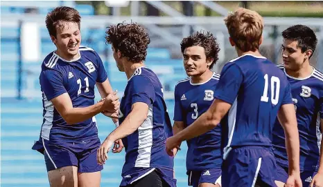  ?? Marvin Pfeiffer/staff Photograph­er ?? Boerne forward Hudson Vickery left, celebrates with teammates after scoring what would be the game-winning goal in the Class 4A semifinals of the UIL State Soccer Tournament on Wednesday in Georgetown.