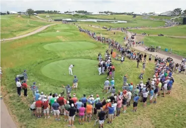  ?? RICK WOOD / MILWAUKEE JOURNAL SENTINEL ?? Ricky Fowler tees off on the 10th hole during practice for the 2017 U.S. Open at Erin Hills Wednesday.