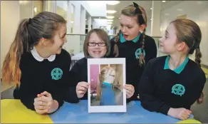  ?? Photograph: Anthony MacMillan Photograph­y. ?? Samara McCormack shows off her new ‘do’ to her fellow pupils.